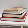 Stack of real books staged for display. Large and small books used for decorating. 