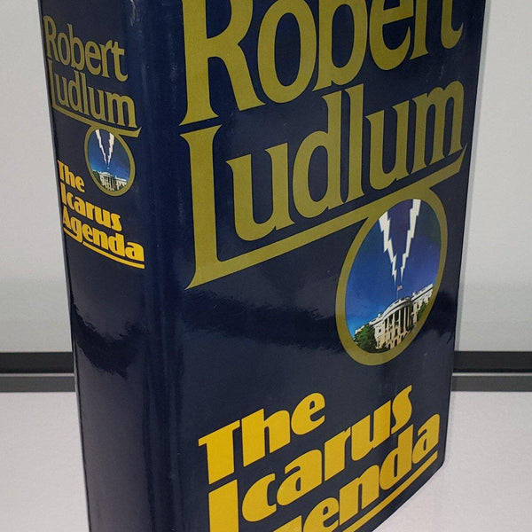 Vintage blue hardcover book. First edition hardcover book Acarus Agenda by Robert Ludlem.