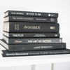 Set of hardcover black books for men's shelf décor.