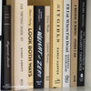 Set of neutral books with black and white font for home display and decoration.