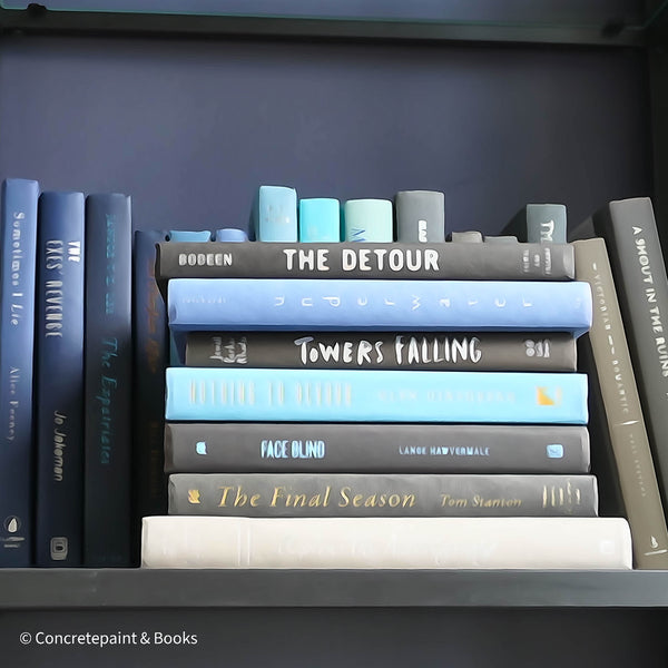 Black and blue books used for decorating shelves.