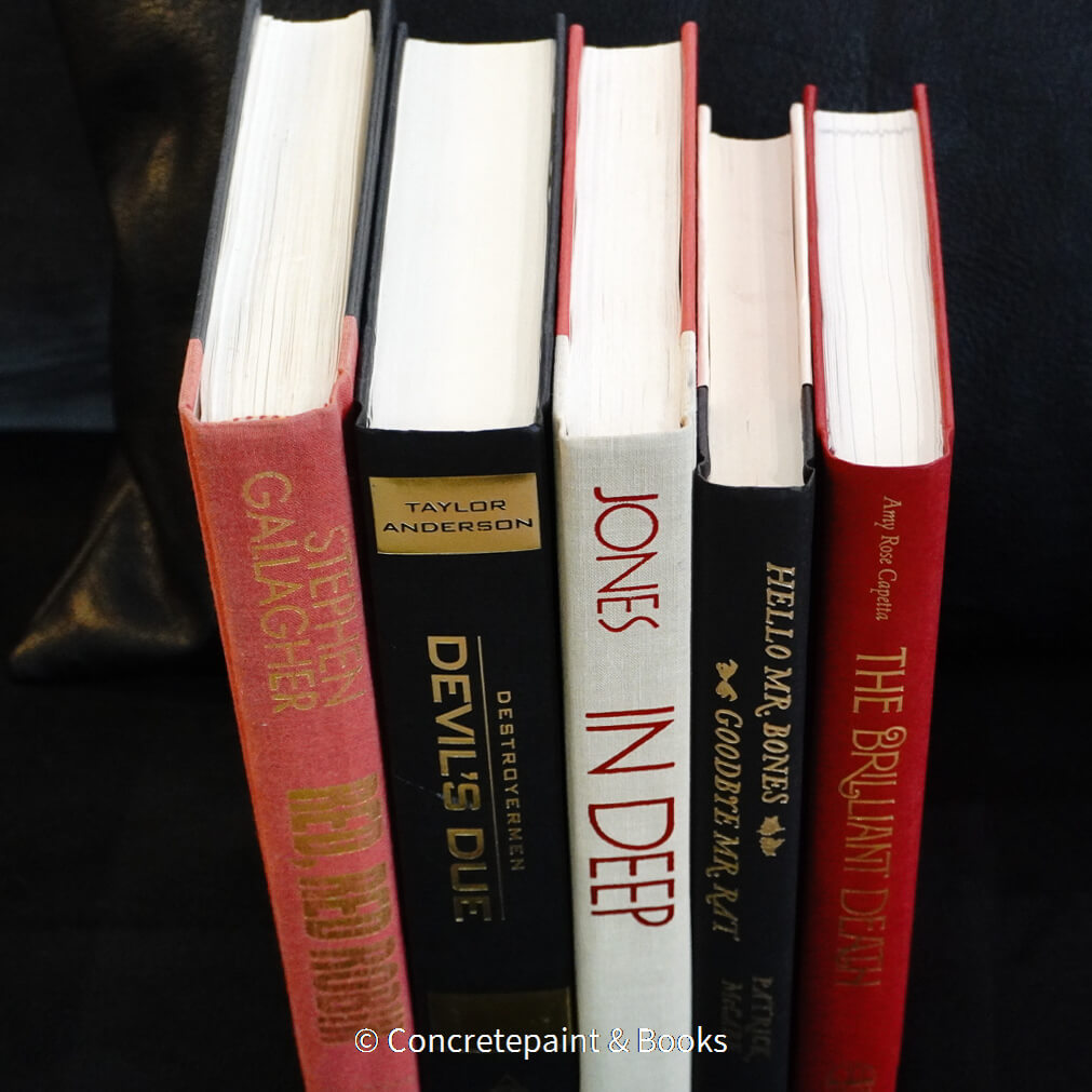 Black red and neutral halloween décor. Real hardcover books used for decorating. 