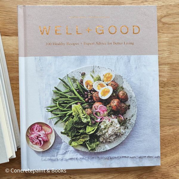 stack of cookbooks for decorating kitchen. White and blush kitchen decor. 