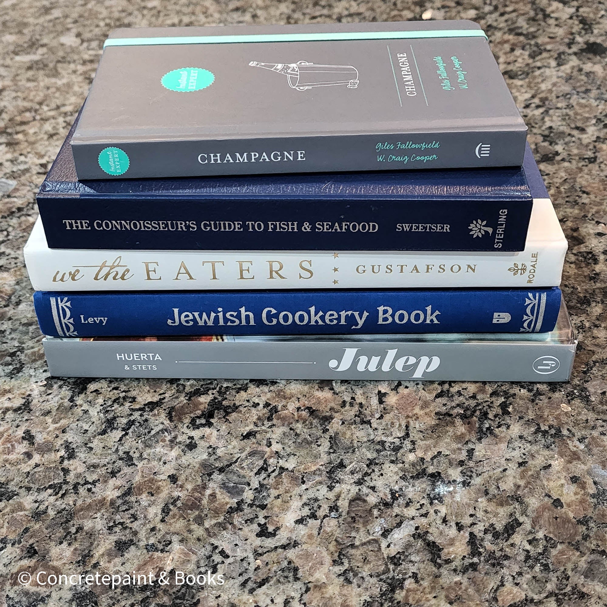 Diet and cookbooks for decoration and reading. Neutral, blue and gray kitchen or coffee table decoration.