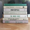 Green neutral and gray real hardcover book stack used for decoration.