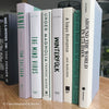 Green neutral and gray real hardcover book stack used for decoration.