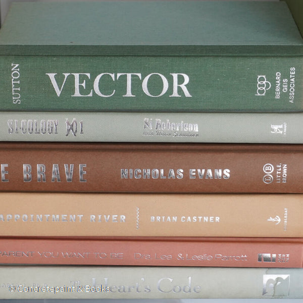 Green and brown books used for shelf decor. 