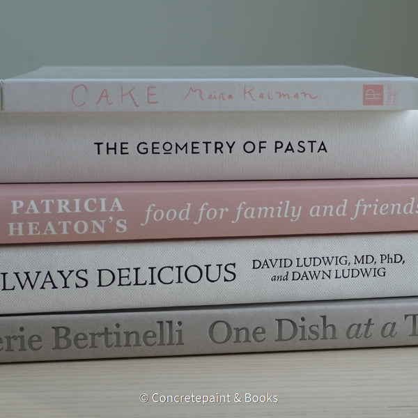 Stack of hardcover books used to decorate. Blush and neutral display books.