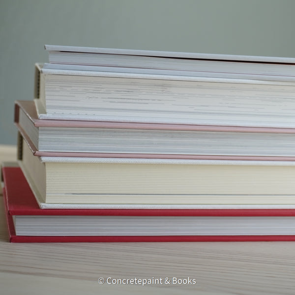 Stack of hardcover books used to decorate. Blush and neutral display books.