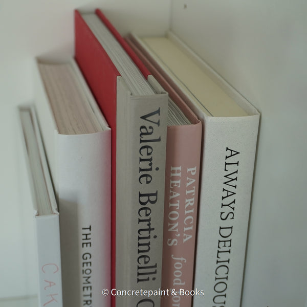 Stack of hardcover books used to decorate. Blush and neutral display books.