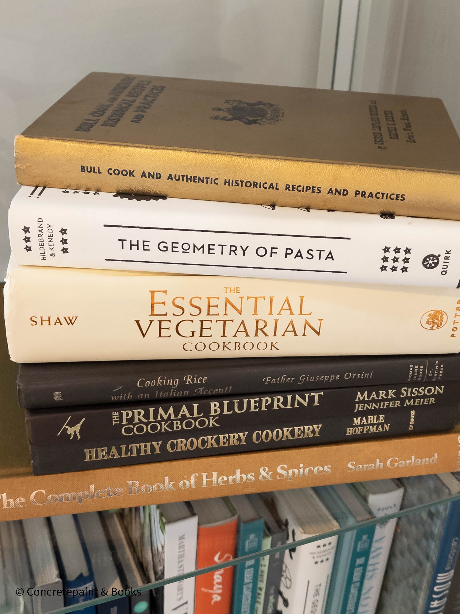 neutral, black, white and gold kitchen decoration. Cookbooks used as kitchen decoration  