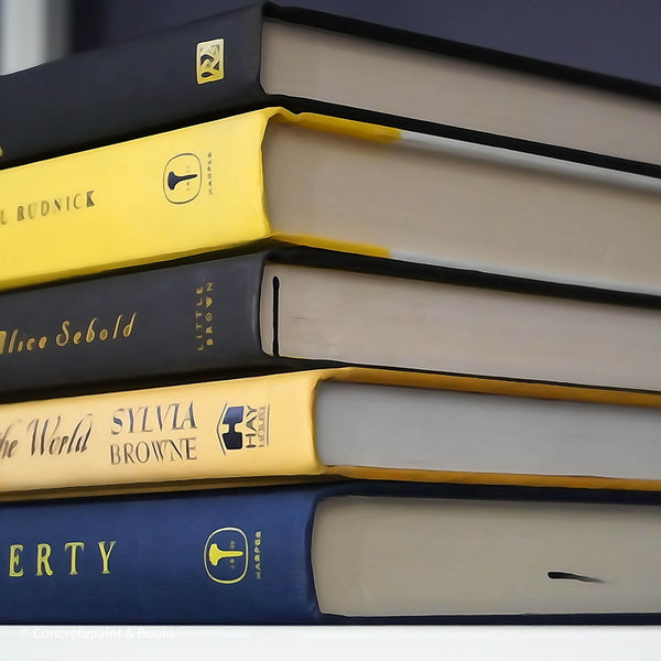 Blue, black and yellow book used for shelf decoration. Hardcover books for decor.