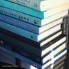 Real hardcover books in shades of blue for home decoration.